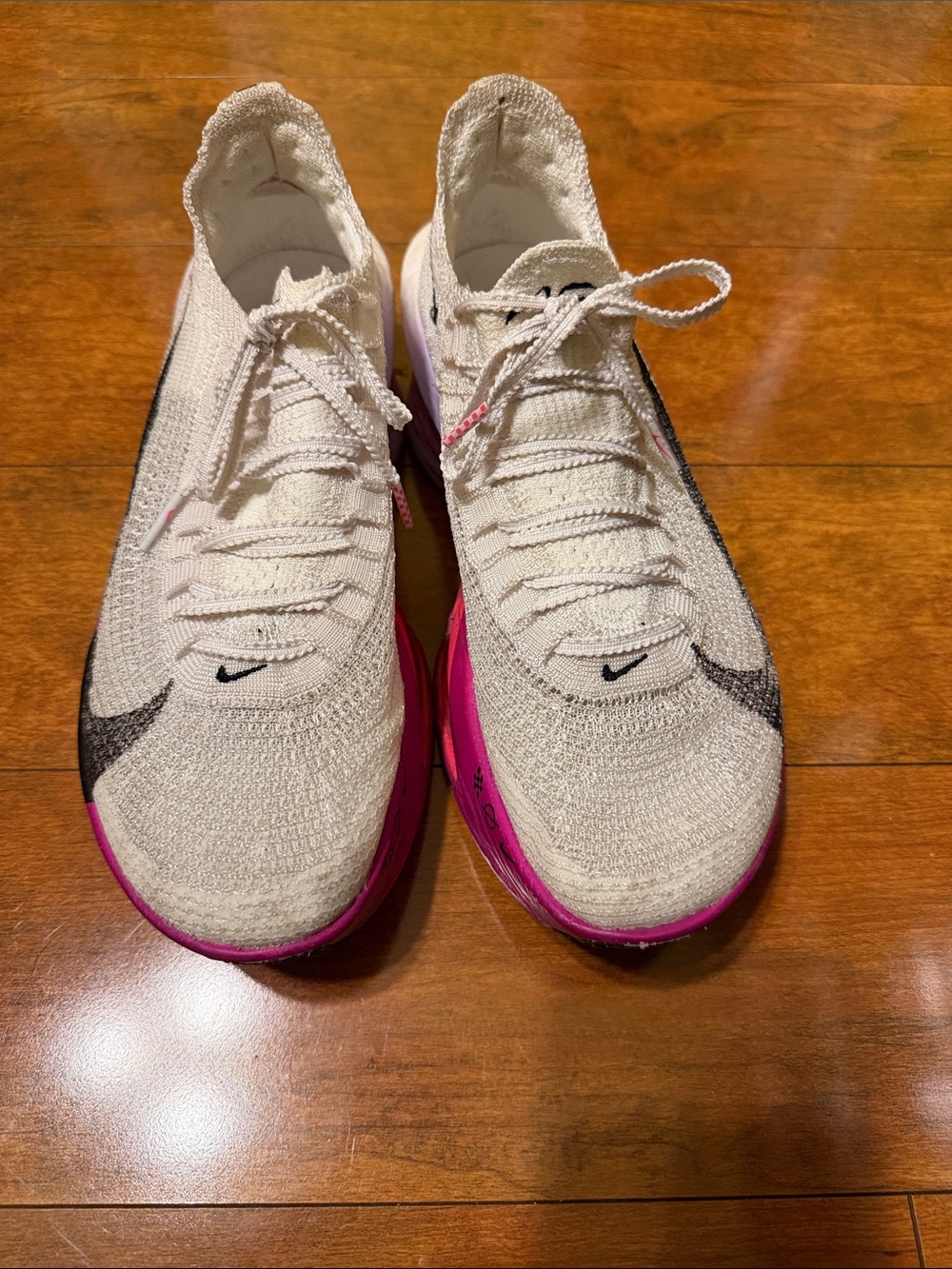 Nike Women's White Knit Running Shoes with Pink and Black Accents